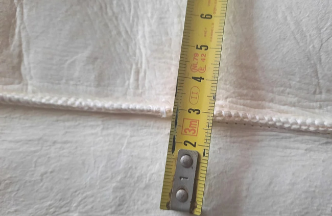 naad in schapenvacht: reparatie